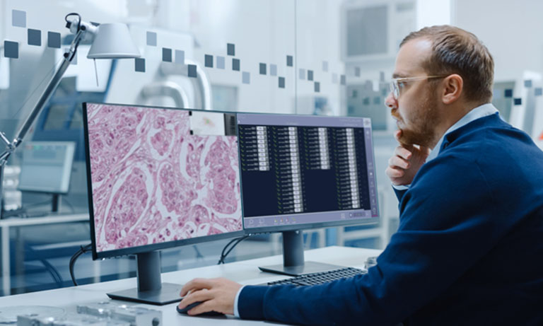 pathologist looking at digital scans