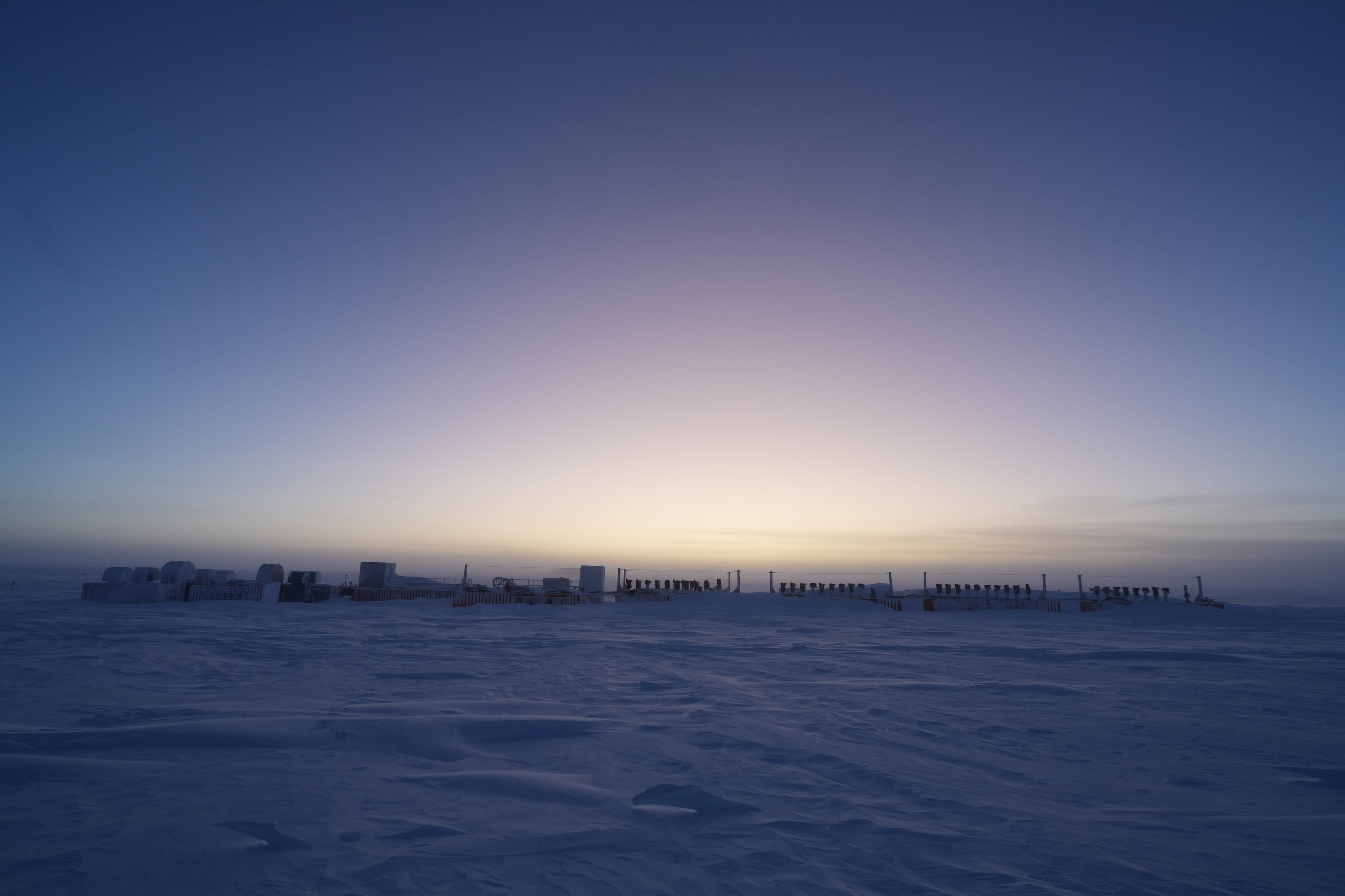 IceCube Upgrade drill camp at sunrise.